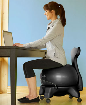 Woman Sitting on Gaiam Balance Ball Chair at Desk